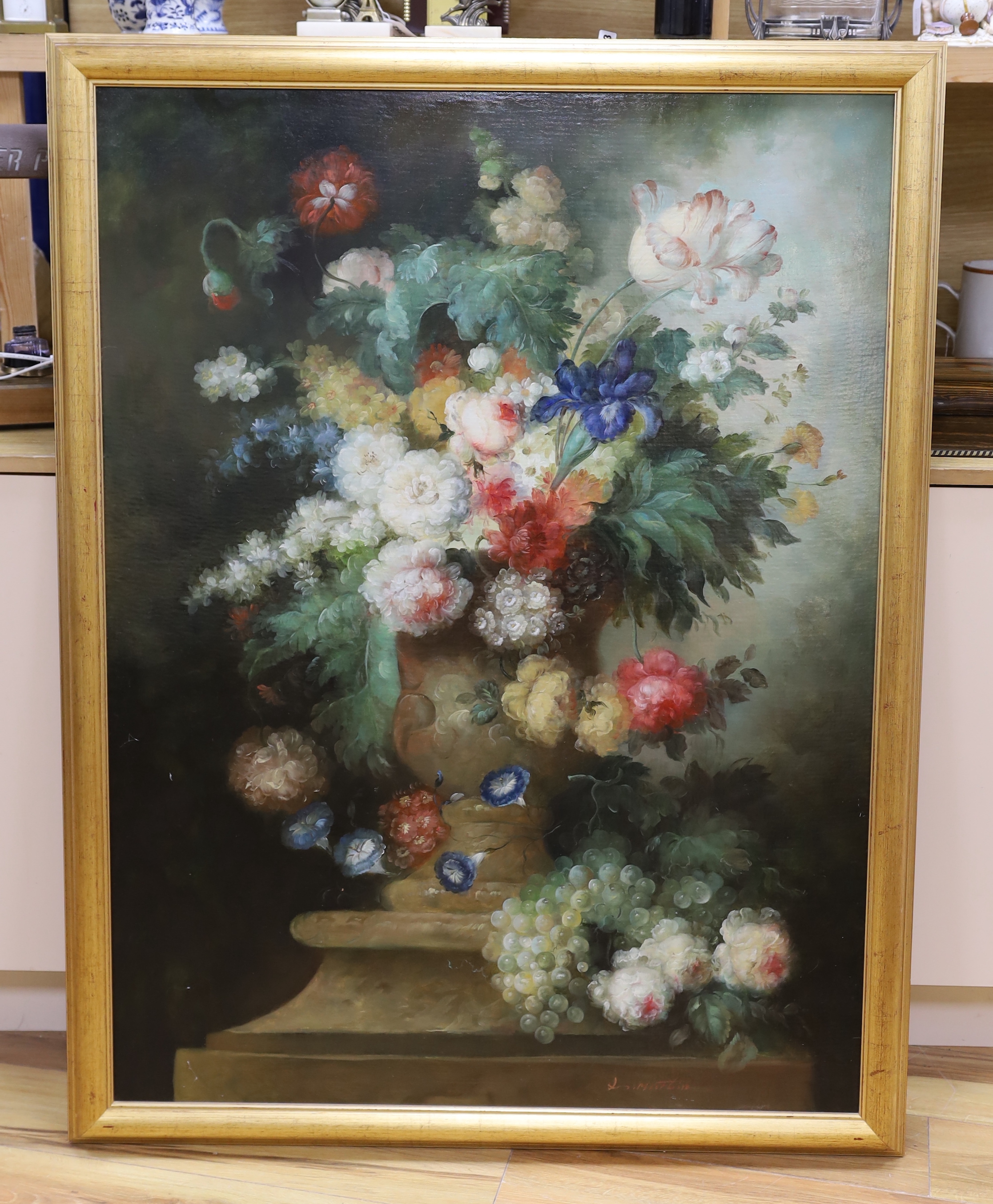 After the 17th century Dutch style, oil on canvas, Still life, vase of flowers and grapes in a vase and on a ledge, indistinctly signed, 120 x 89cm